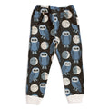 Children's pajama pants with owl and moon pattern on a dark background