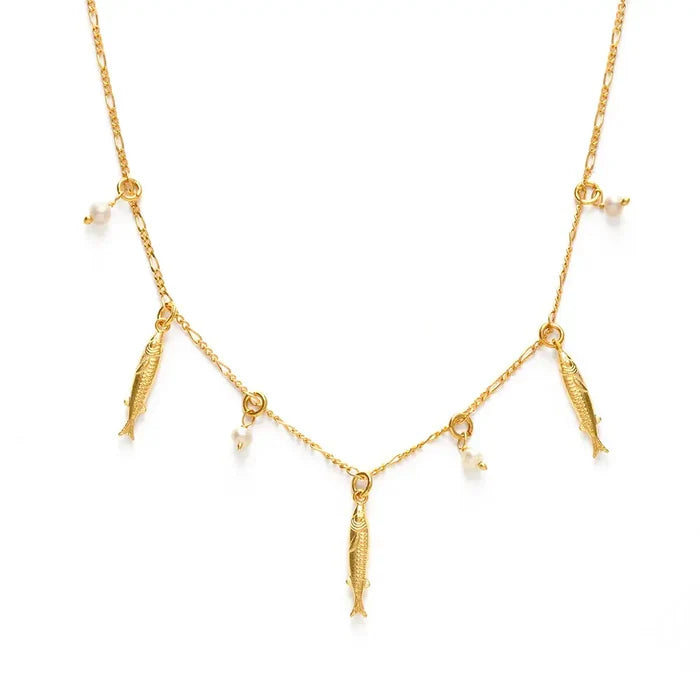 Gold necklace with fish and pearl charms on a white background
