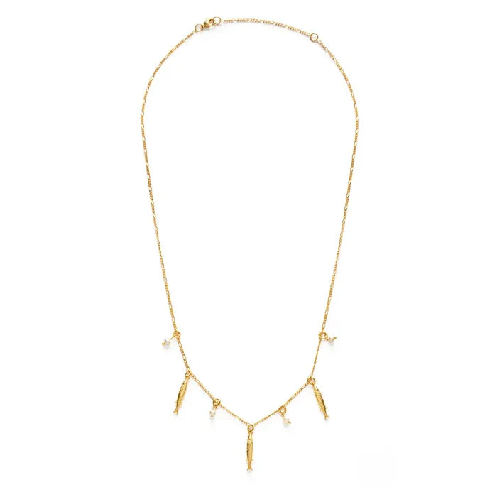 Gold necklace with small pendants on a white background