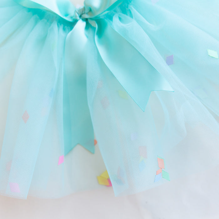 A close-up of the ribbon and confetti interspersed in the tutu
