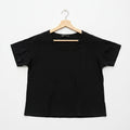 Black t-shirt on a wooden hanger against a white background